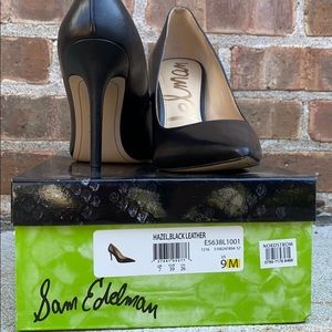 Black pointed toe pumps